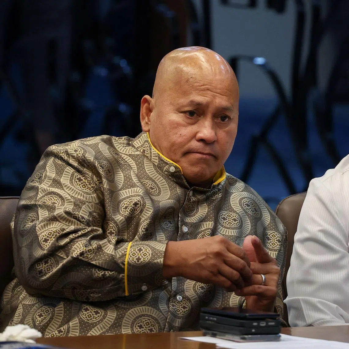 Philippine senators Ronald dela Rosa (left) and Bong Go attending a session at the Senate, which holds dela Rosa under protective custody amid an International Criminal Court warrant, in Pasay City on May 13.