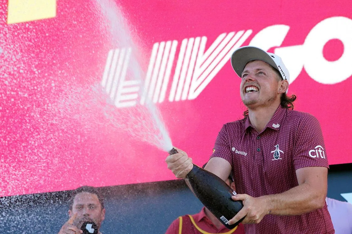 Cameron Smith of Australia celebrating on the podium after winning the LIV Golf-Bedminster event.