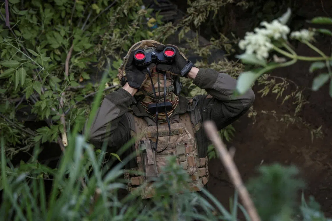 FILE PHOTO: A Ukrainian serviceman from an air defence unit of the 93rd Mechanized Brigade monitors the sky at a frontline, amid Russia's attack on Ukraine, near the town of Bakhmut, Ukraine May 23, 2024. REUTERS/Oleksandr Ratushniak/File Photo
