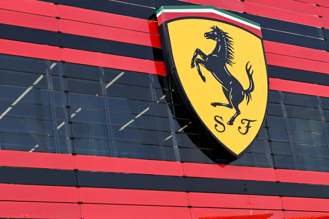 FILE PHOTO: The logo of Ferrari is seen in the headquarters, in Maranello, Italy, June 15, 2022. Picture taken June 15, 2022. REUTERS/Flavio Lo Scalzo