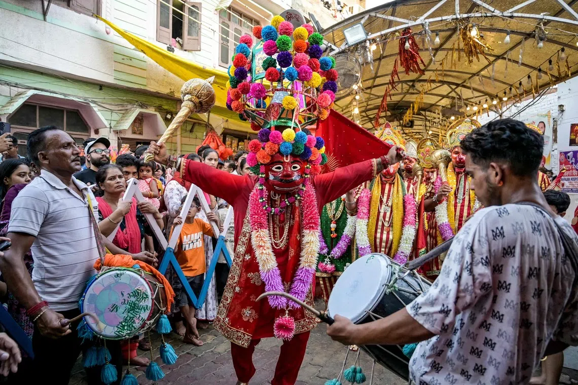 A devotees dressed as Hindu deity Hanuman taking part in a celebration during a religious procession on the occasion of Navaratri festival in Amritsar, India on Sept 30, 2025. 