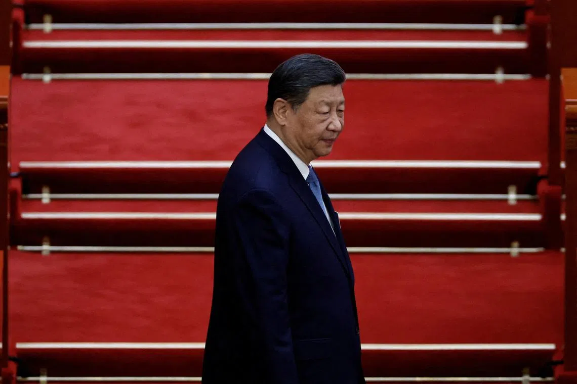 FILE PHOTO: Chinese President Xi Jinping arrives for the second plenary session of the National People's Congress (NPC), at the Great Hall of the People in Beijing, China March 8, 2025. REUTERS/Tingshu Wang/File Photo