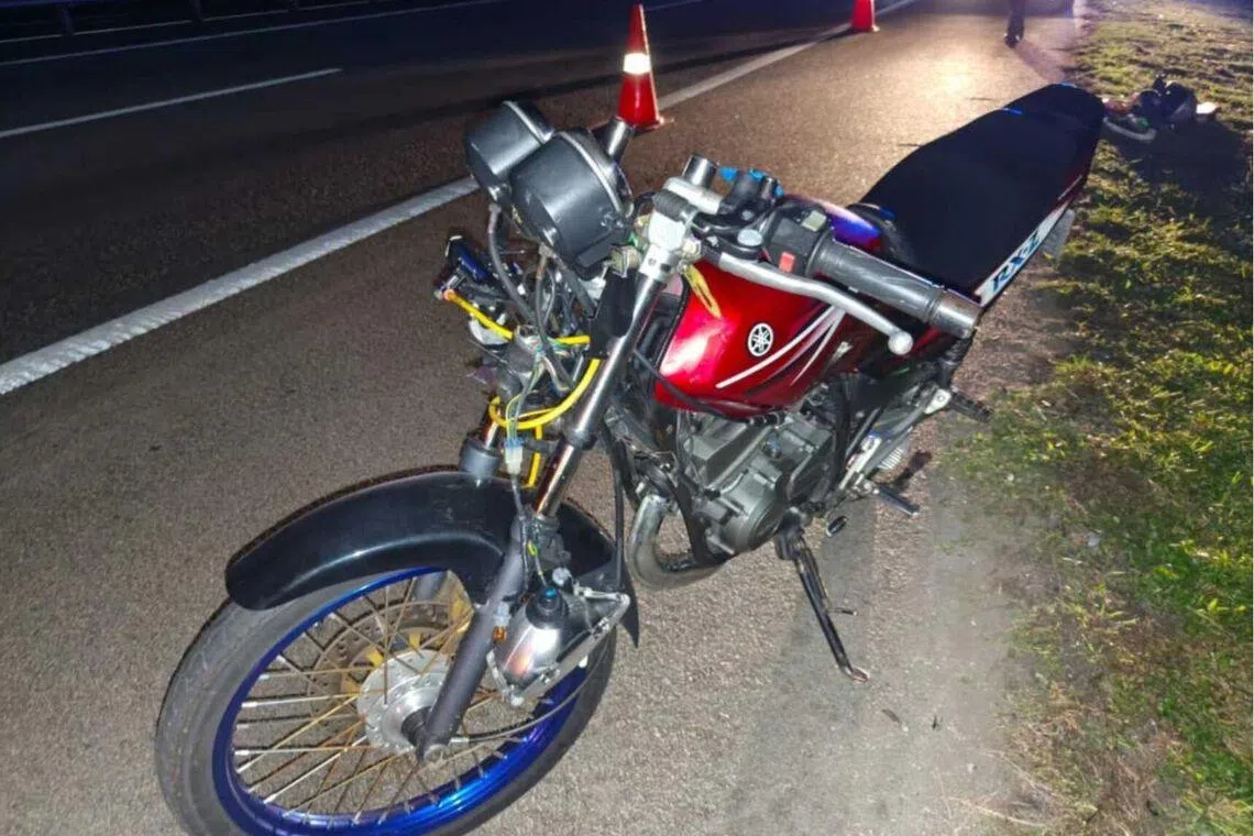 The motorcycle ridden by the 20-year-old Singaporean after it was struck by a lorry on the North-South Expressway.