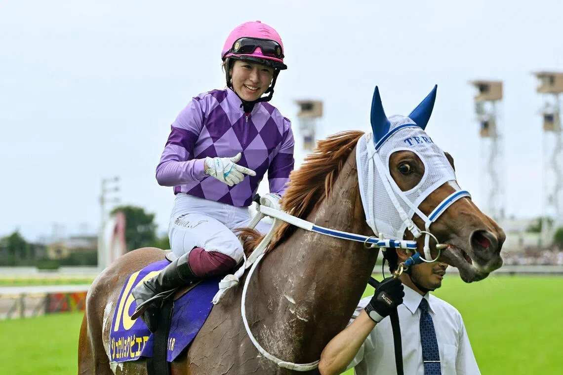 Jockey Seina Imamura looks on atop Juryoku Pierrot after winning the Japanese Oaks at Tokyo Racecourse in Tokyo on May 24, 2026.
