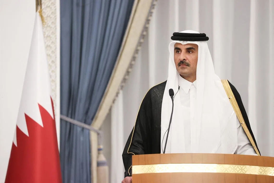 Qatar's Emir Sheikh Tamim bin Hamad al-Thani looks on during a press conference with Iranian President Masoud Pezeshkian (not pictured) in Doha, Qatar, October 2, 2024. Iran's Presidency/WANA (West Asia News Agency)/Handout via REUTERS/File Photo