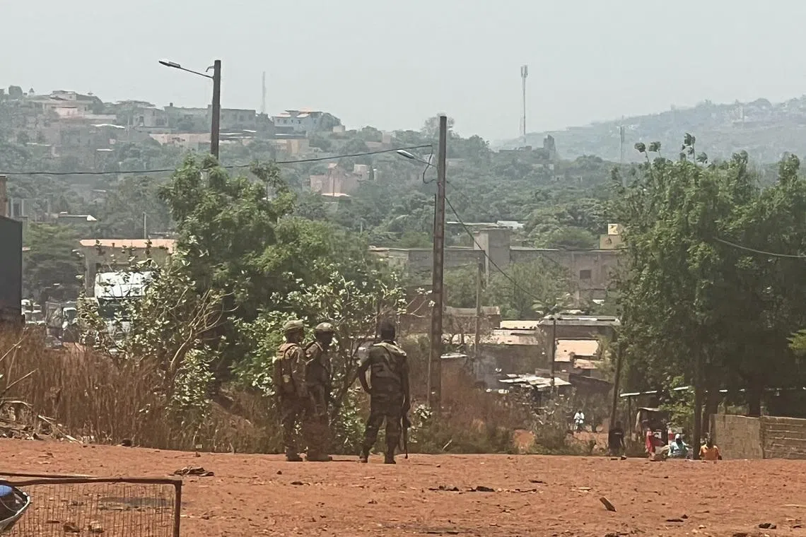 FILE PHOTO: Malian soldiers stand during a patrol following the attack on Mali's main military base Kati, outside the capital Bamako, in Kati, Mali, April 26, 2026. REUTERS/Stringer/File Photo