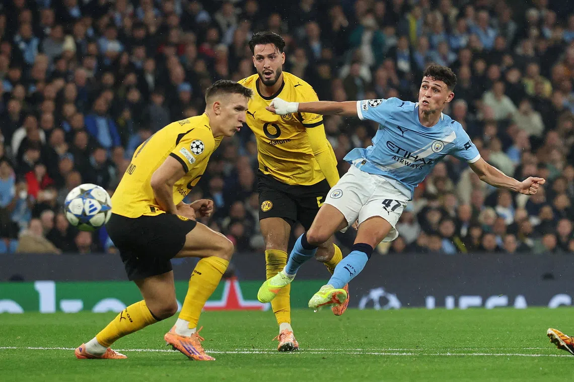Soccer Football - UEFA Champions League - Manchester City v Borussia Dortmund - Etihad Stadium, Manchester, Britain - November 5, 2025 Manchester City's Phil Foden scores their third goal REUTERS/Phil Noble     TPX IMAGES OF THE DAY