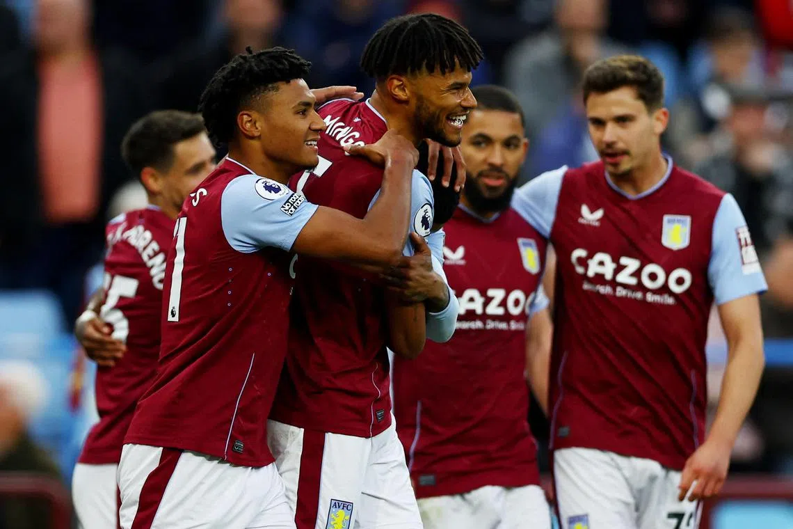 Defender Tyrone Mings celebrates his goal for Aston Villa with teammate Ollie Watkins.