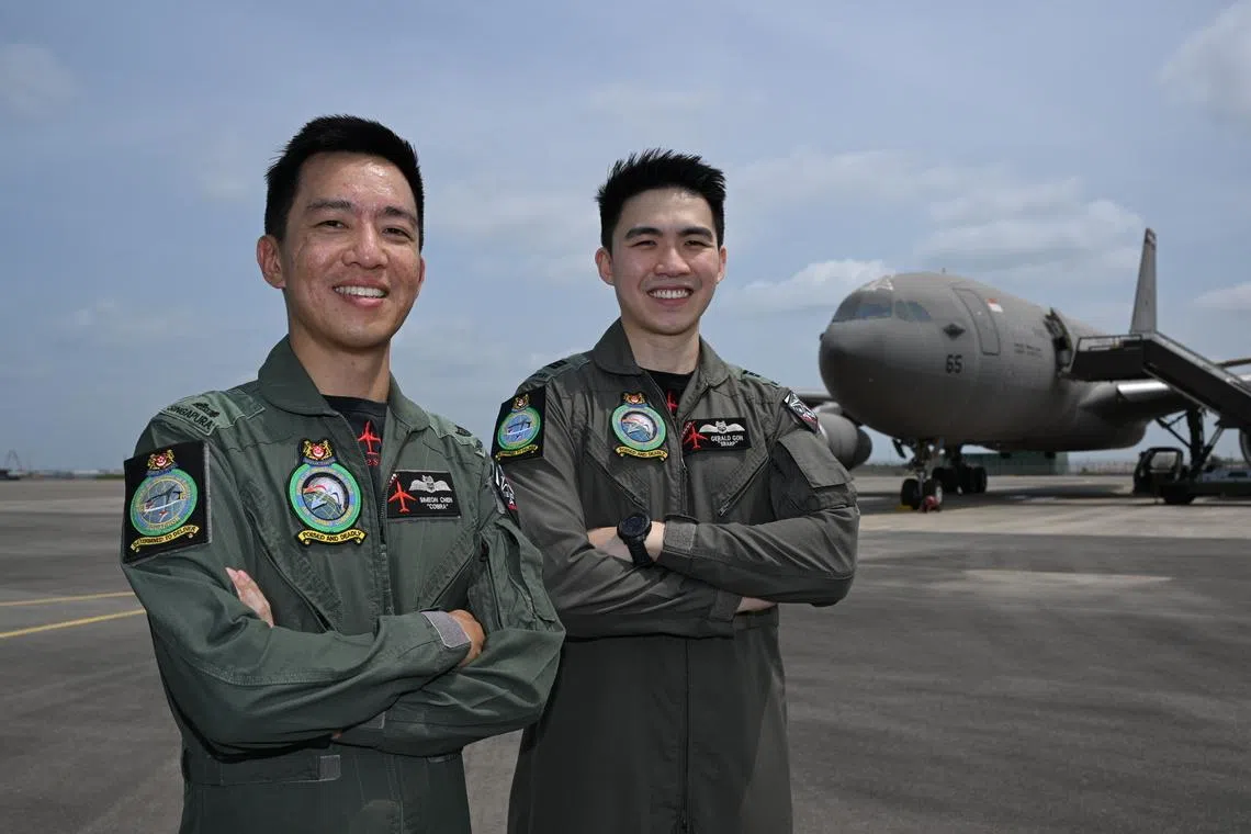 Major Simeon Chen (left) and Captain Gerald Goh who were part of the operation for the two repatriation flights, photographed with the MRTT on March 27.