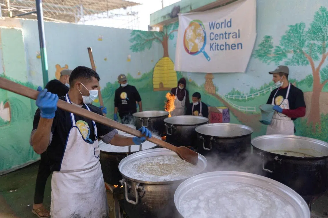 FILE PHOTO: Members of \"World Central Kitchen\" prepare food for Palestinians, in the location given as Gaza, amid the ongoing conflict between Israel and Hamas, in this picture released on March 21, 2024 and obtained from social media. Courtesy of @chefjoseandres via X/via REUTERS/File Photo