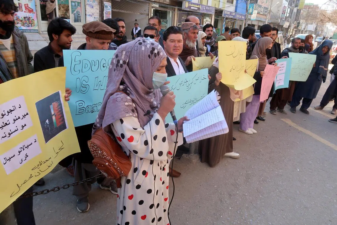 Afghan refugees in Pakistan hold placards during a protest as they demand the Taliban government to allow education for girls, in Quetta, the provincial capital of Balochistan province in Pakistan.