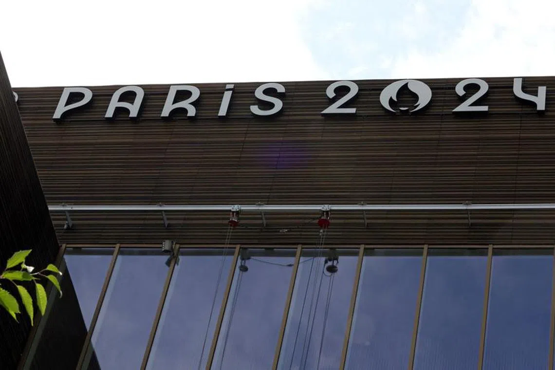 The logo of the Paris 2024 Olympics and Paralympics Games is seen on the Pulse building, the headquarters of the Paris 2024 Olympics organizing committee, as a police search is currently underway, in Saint-Denis near Paris, France, June 20, 2023. REUTERS/Stephanie Lecocq/File Photo