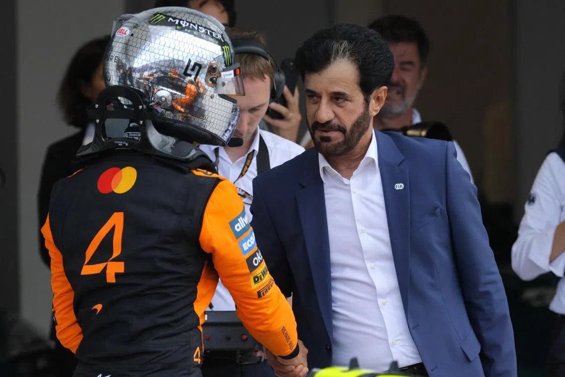Formula One F1 - Miami Grand Prix - Miami International Autodrome, Miami, Florida, United States - May 3, 2025 McLaren's Lando Norris shakes hands with FIA president Mohammed ben Sulayem after finishing second during qualifying REUTERS/Brian Snyder/File Photo