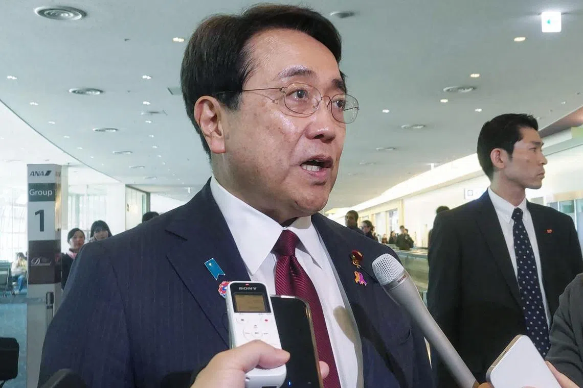 Japan's Economic Revitalisation Minister Ryosei Akazawa, the country's envoy for upcoming tariff talks with the US, speaks to the media ahead of his flight to the US, at Tokyo International Airport at Haneda on April 16. 