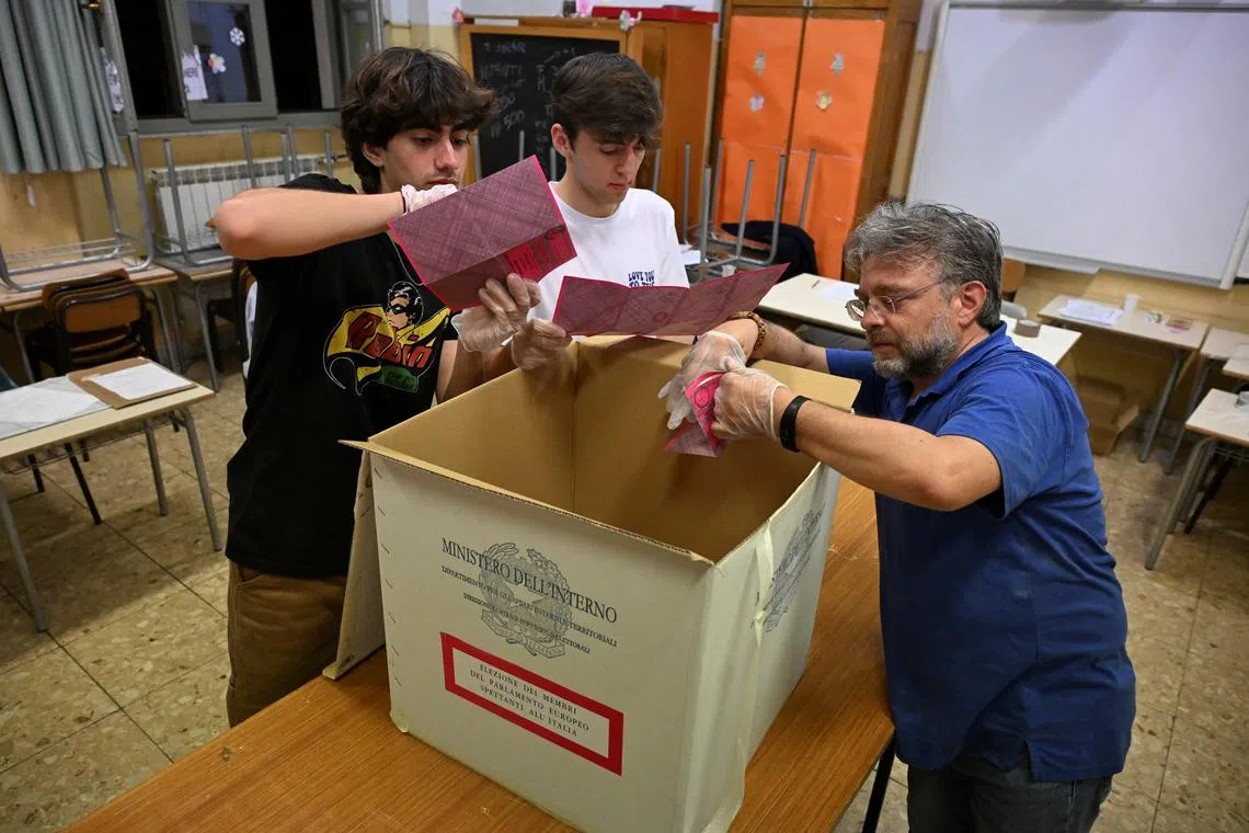 FILE PHOTO: Election officials count votes, at a polling station for the European Parliamentary election, in Rome, Italy, June 9, 2024. REUTERS/Alberto Lingria/File Photo