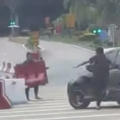 A car with a Malaysian registration number was seen entering the heavy vehicle lane at Gate C.