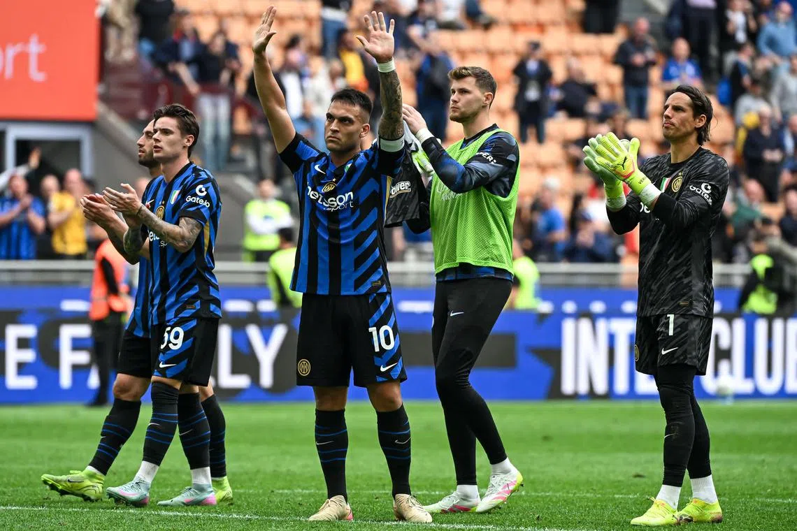 Inter Milan players acknowledge fans at the end of their 1-0 home loss to Roma.