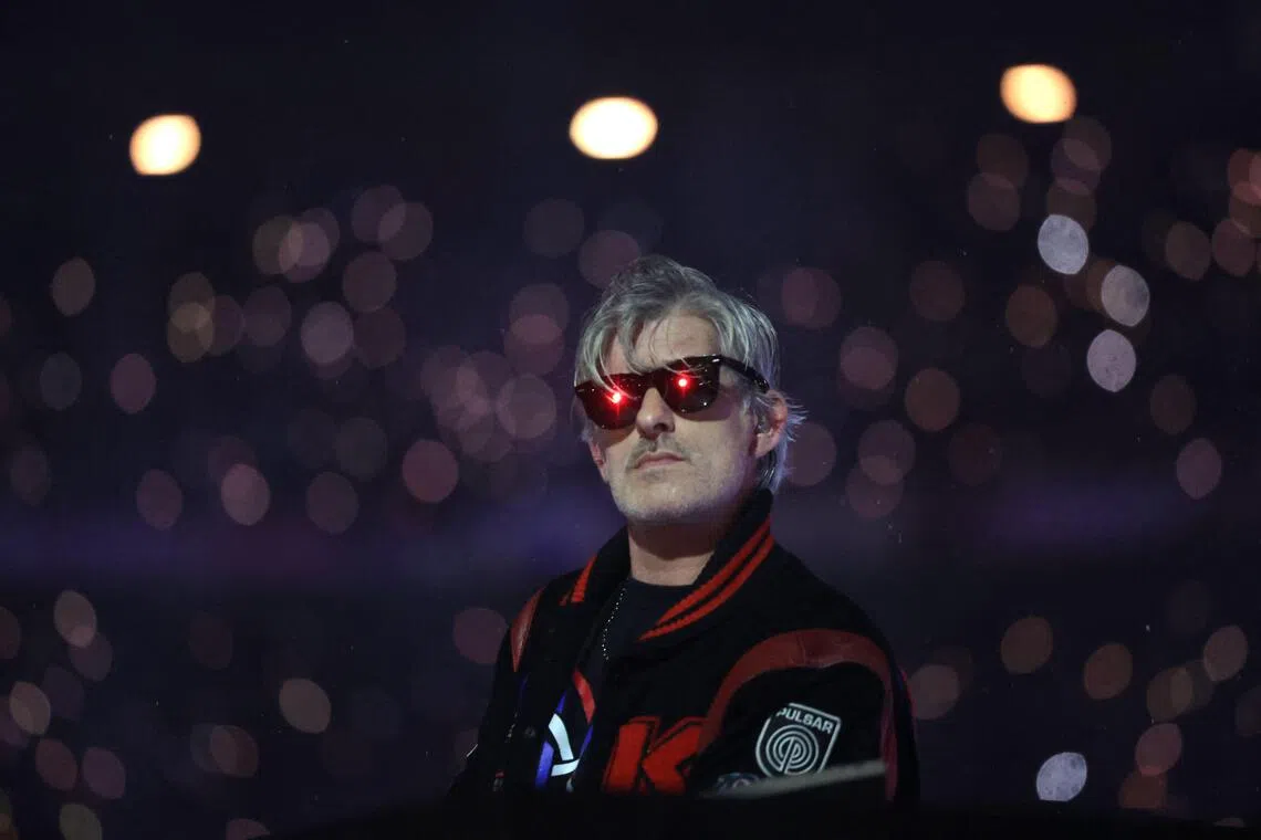 (FILES) French DJ Kavinsky performs on stage during the Paris 2024 Paralympic Games Closing Ceremony at the Stade de France, in Saint-Denis, in the outskirts of Paris, on September 8, 2024. French DJ Kavinsky was found dead at his place in Paris announced Paris' prosecutor's office (Photo by Thibaud Moritz / AFP)