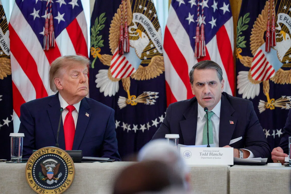 US Attorney-General Todd Blanche (right), with US President Donald Trump, delivers remarks during a roundtable on Protecting American Families and Seniors from Cybercrime in the East Room of the White House in Washington DC, on Oct 21.