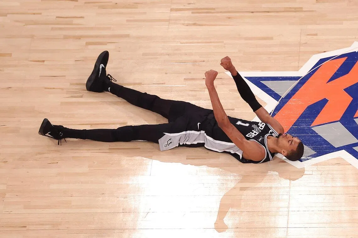 Victor Wembanyama of the San Antonio Spurs reacts after shooting a three point basket and being fouled during the fourth quarter against the New York Knicks on June 8.
