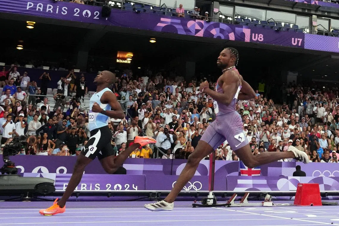 FILE PHOTO: Paris 2024 Olympics - Athletics - Men's 200m Semi-Finals - Stade de France, Saint-Denis, France - August 07, 2024. Letsile Tebogo of Botswana crosses the line to win semi final 2 ahead of Noah Lyles of United States. REUTERS/Sarah Meyssonnier/File Photo