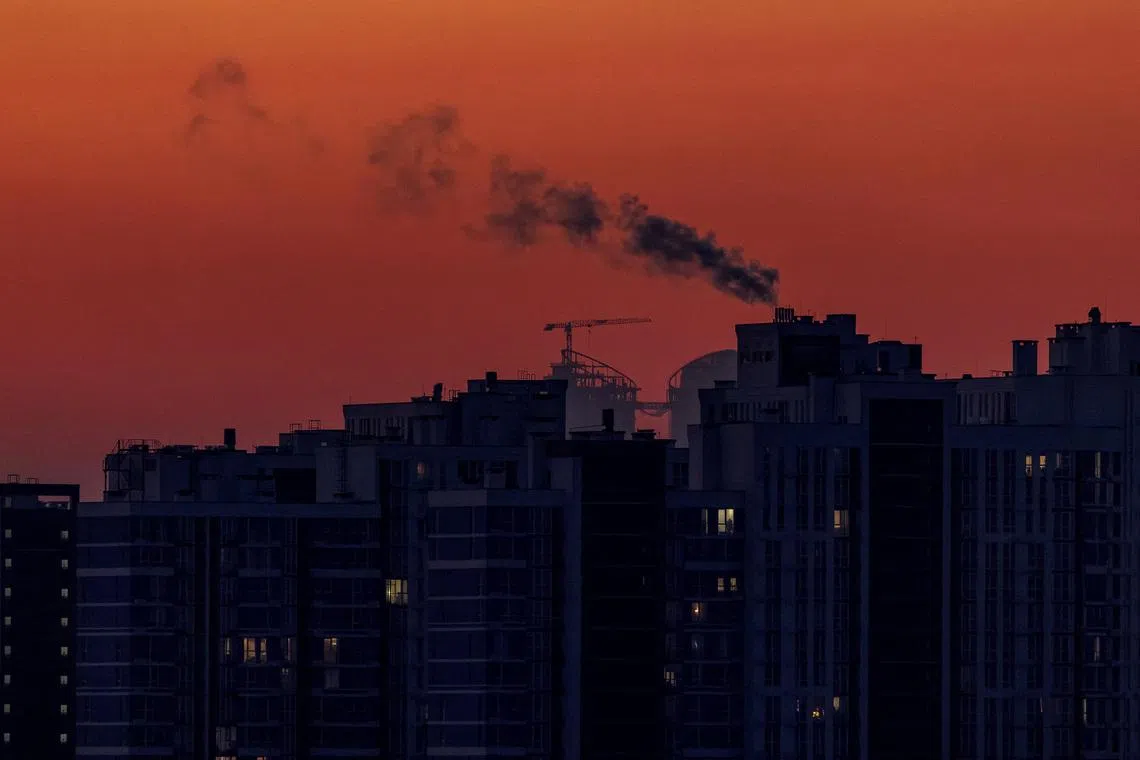 FILE PHOTO: Water vapour rises from residential buildings' autonomous heating systems during a power blackout and freezing temperatures, after critical civil infrastructure was hit by recent Russian missile and drone attacks, amid Russia's attack on Ukraine, in Kyiv, Ukraine January 19, 2026. REUTERS/Vladyslav Sodel/File Photo
