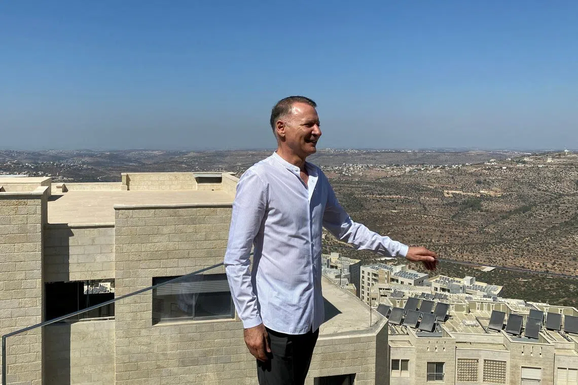 FILE PHOTO: Bashar Masri, a prominent Palestinian-American businessman and founder of Rawabi, the first planned Palestinian city in the West Bank, poses during an interview with Reuters in Rawabi, October 5, 2020. REUTERS/Rami Ayyub/File Photo