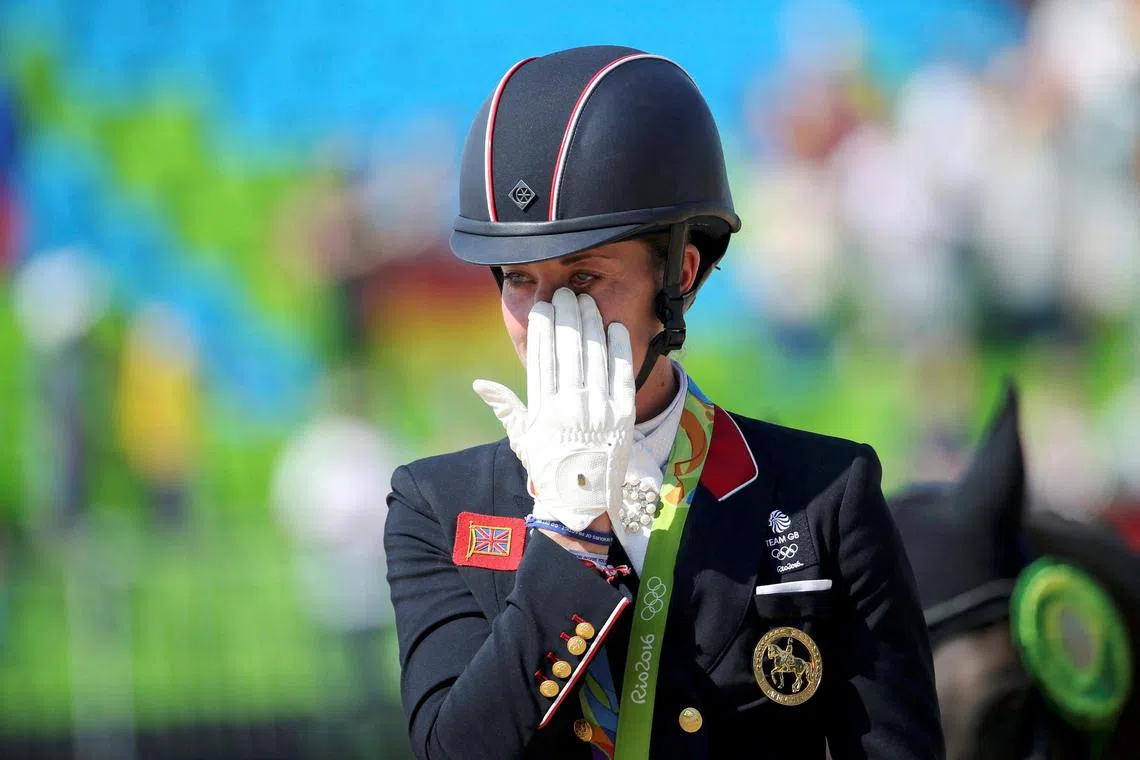 An emotional British rider Charlotte Dujardin after retaining her dressage individual title at the Olympic Equestrian Centre in Rio de Janeiro, Brazil on Aug 15, 2016.