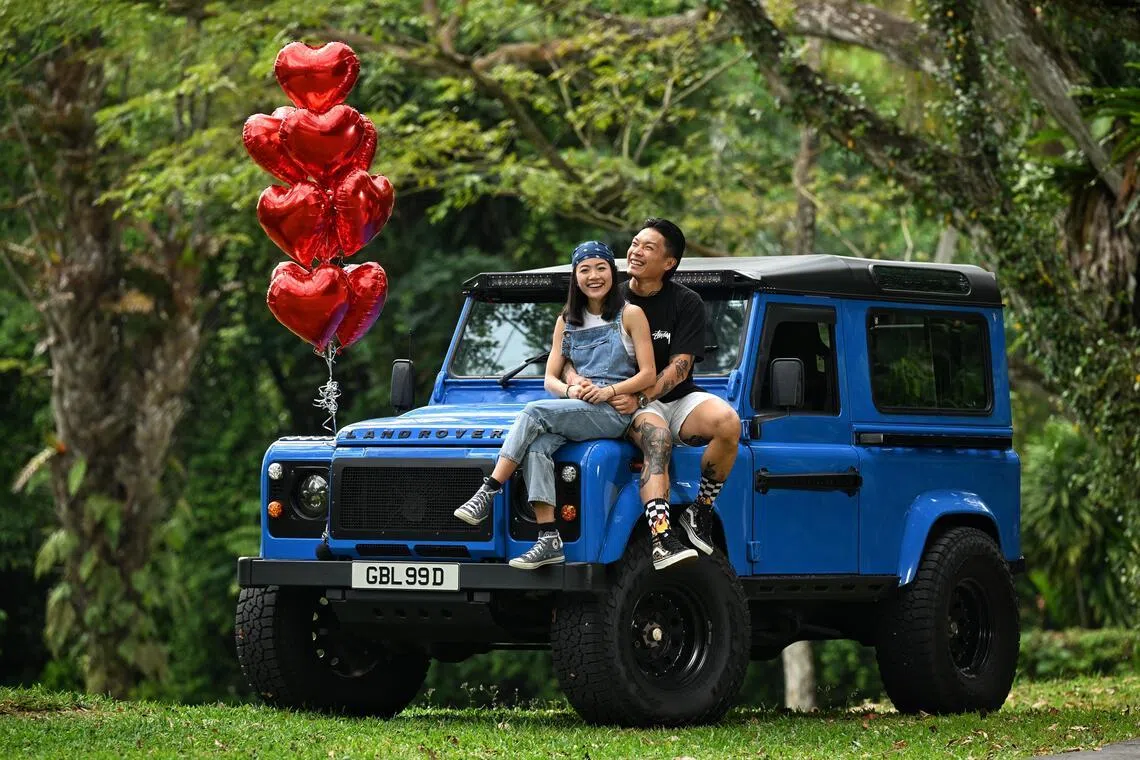 Newly weds Kelvin Ngian,41 and Charmaine Cheong, 32 with their Land Rover Defender 90 which saw them through their courtship days to serving as their bridal car when they married in November last year. They are photographed on Feb 8, 2026.