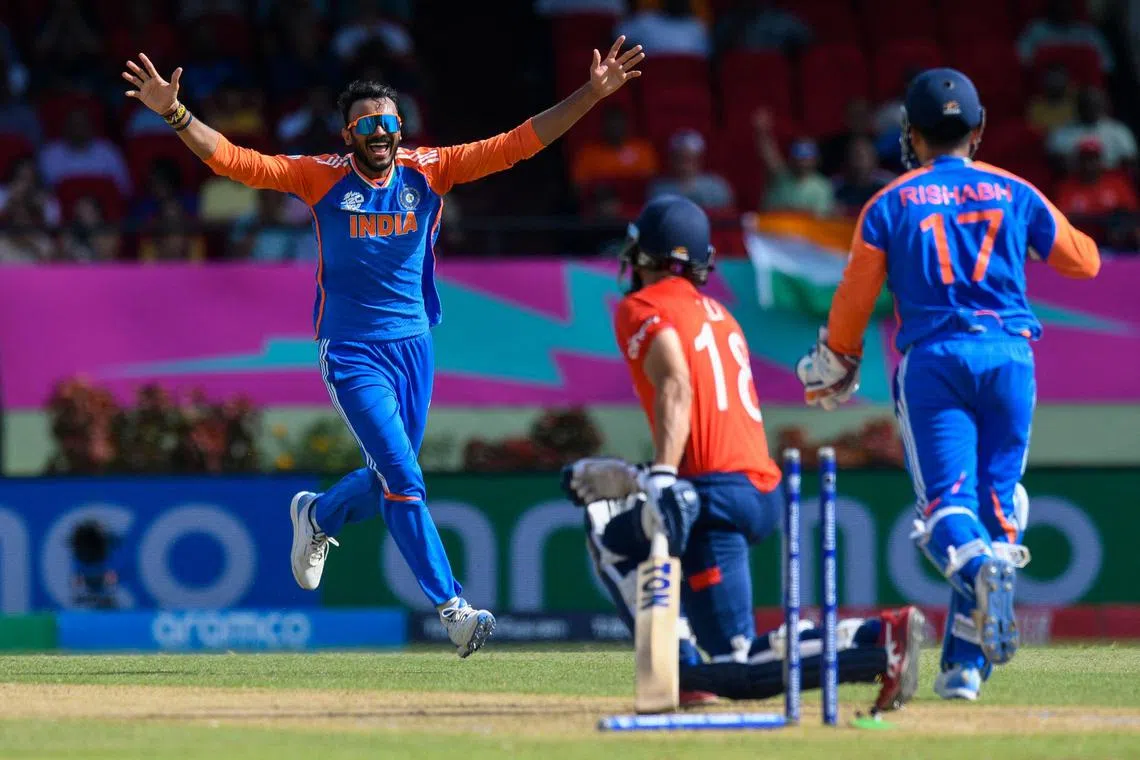 India's Axar Patel celebrates the dismissal of England's Moeen Ali in the ICC men's Twenty20 World Cup semi-final at Providence Stadium in Georgetown, Guyana, on June 27, 2024.