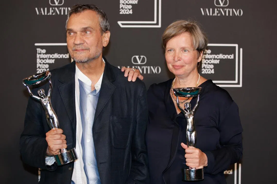 epa11359212 Jenny Erpenbeck (R), author of "Kairos", and translator Michael Hofmann pose for photographers after the novel was announced as winner of the 2024 International Booker Prize at the Tate Modern, London, Britain, 21 May 2024. The International Booker Prize is awarded annually for the finest work of fiction from around the world which has been translated into English and published in the UK or Ireland.  EPA-EFE/DAVID CLIFF