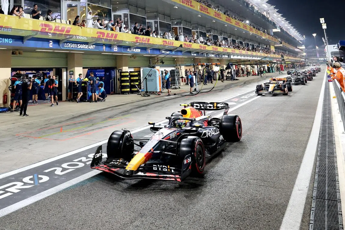 Sergio Perez of Red Bull Racing drives through the pitlane during the Qualifyiing for the Formula 1 Abu Dhabi Grand Prix.