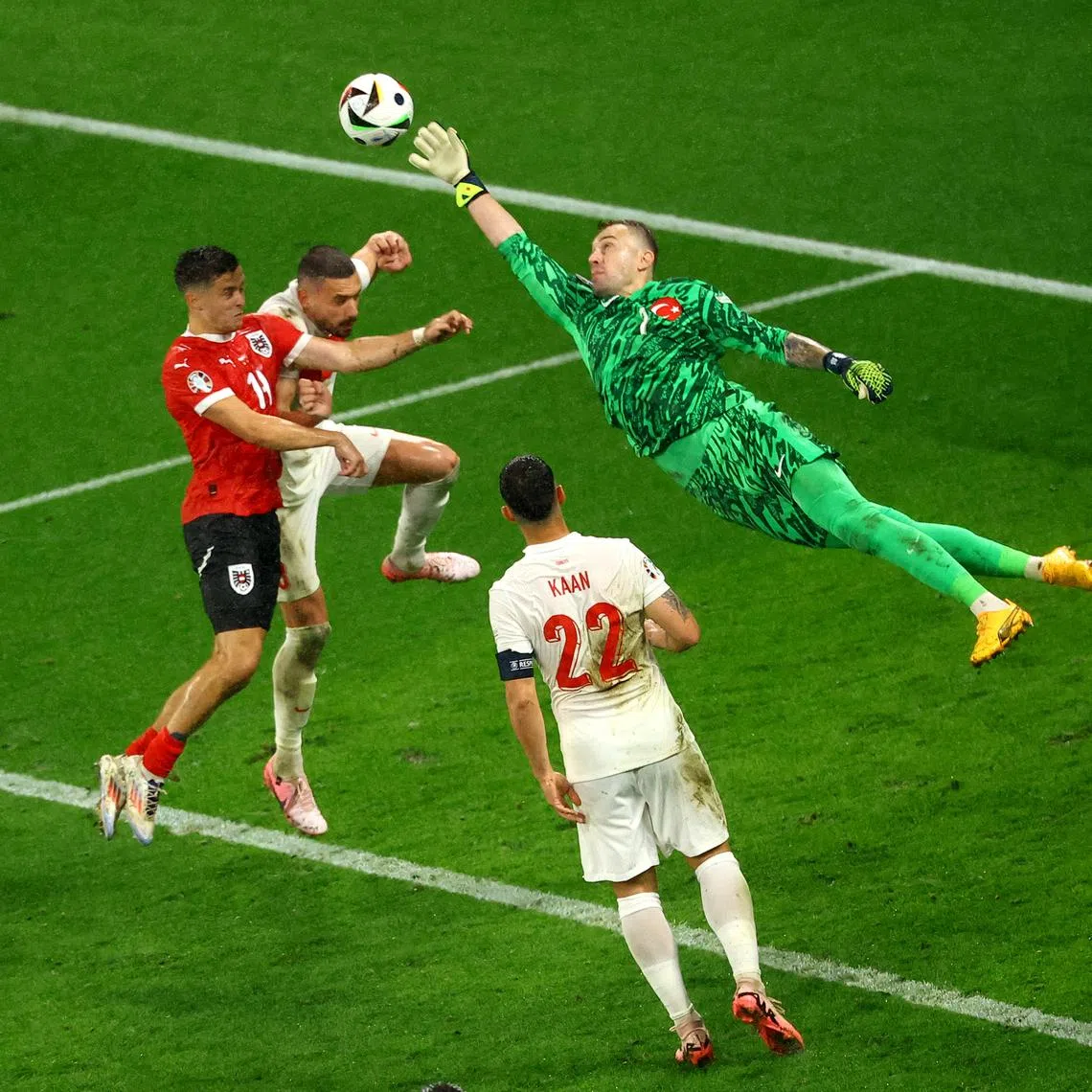Soccer Football - Euro 2024 - Round of 16 - Austria v Turkey - Leipzig Stadium, Leipzig, Germany - July 2, 2024 Turkey's Mert Gunok makes a save from Austria's Christoph Baumgartner REUTERS/Lisi Niesner