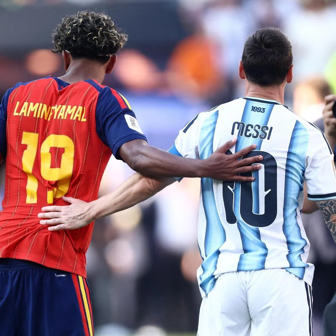 Mutual respect: At the end of a fractious World Cup final, young phenom Lamine Yamal and an old hero Lionel Messi acknowledge each other.