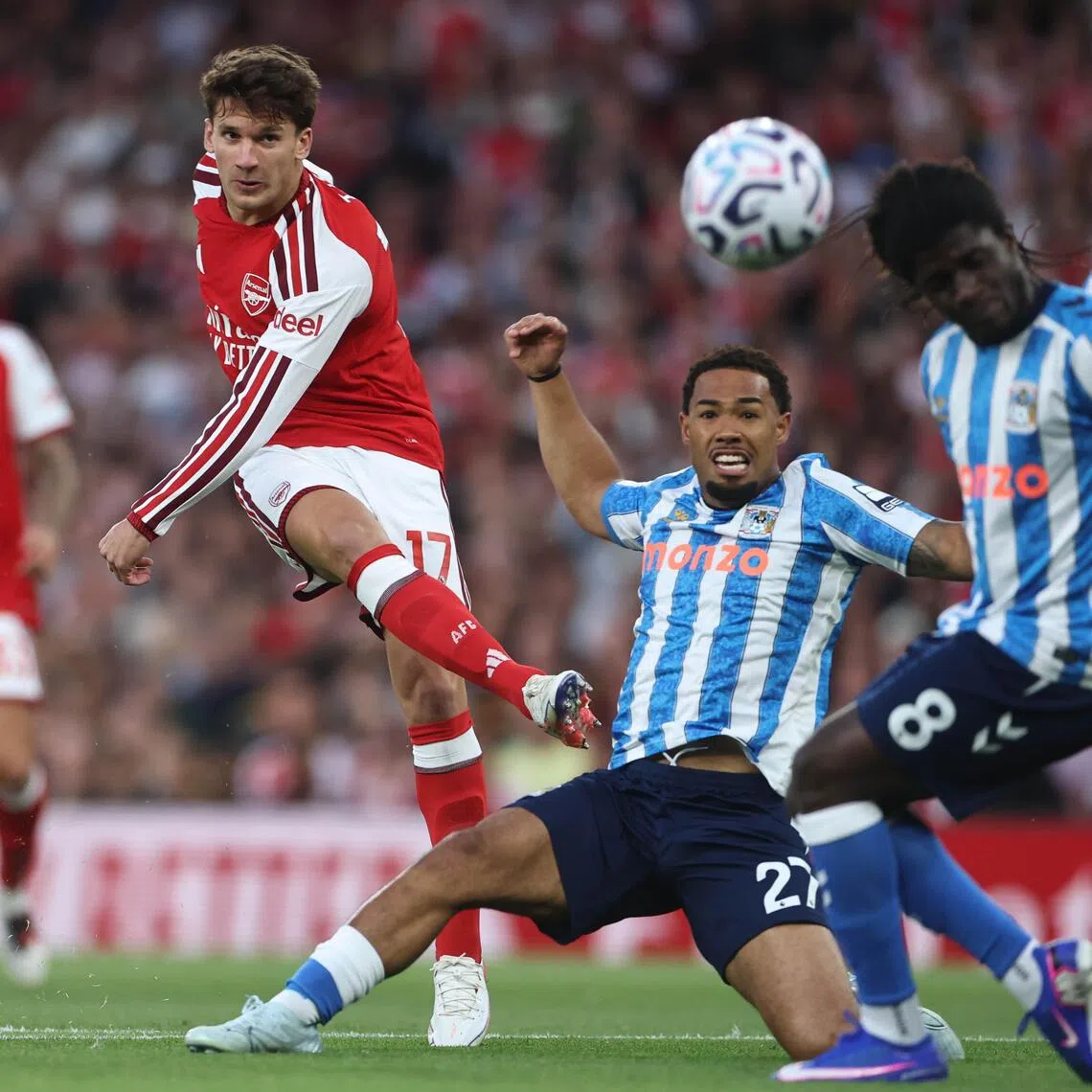 Arsenal winger Christos Tzolis attempting a shot as Coventry City’s Milan van Ewijk and Caleb Yirenkyi try to stop him in the Gunners’ 3-0 EPL win at the Emirates Stadium on Aug 21.