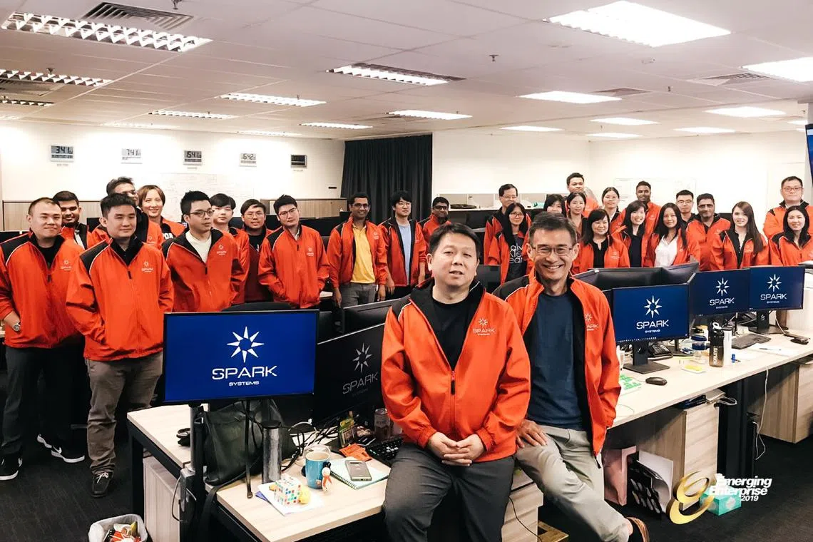 Mr Wong Joo Seng (front row, right) with his team at Spark Systems. 