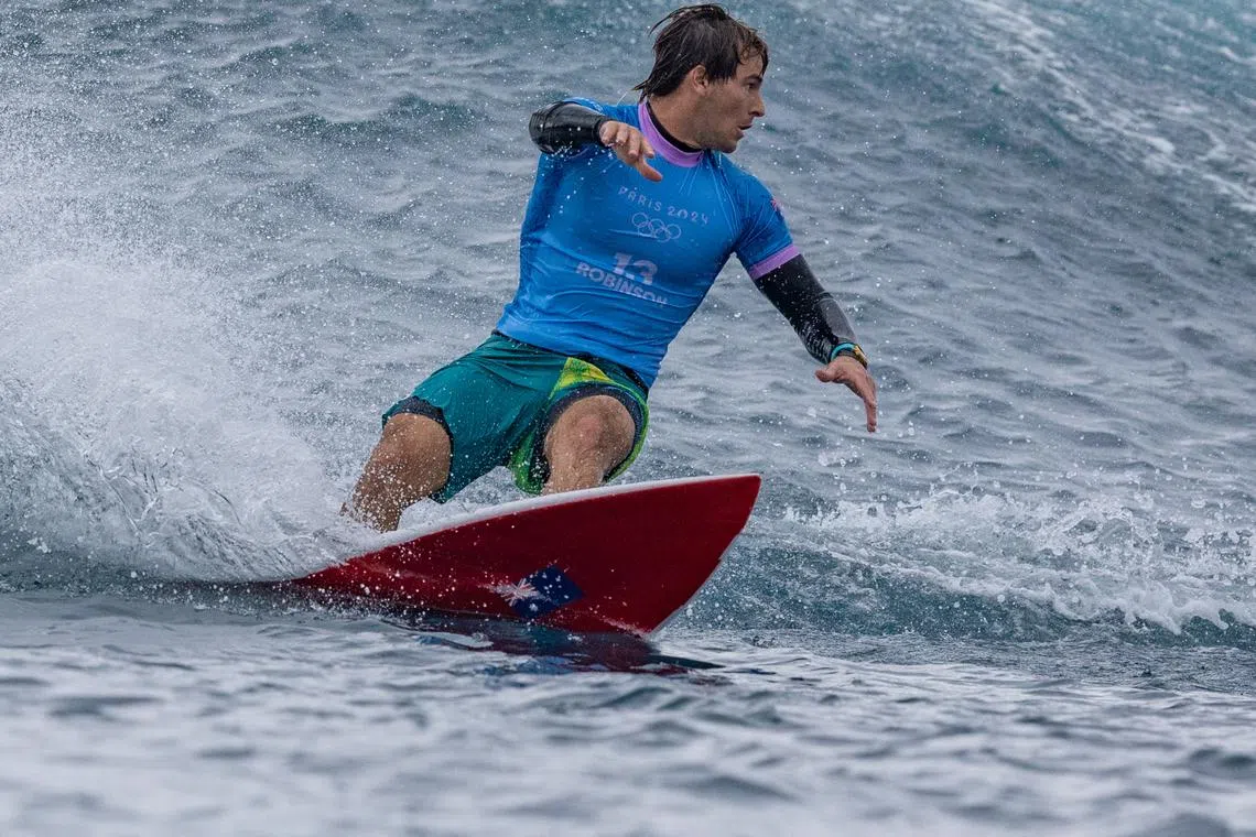 FILE PHOTO: Paris 2024 Olympics - Surfing - Men's Round 3 - Heat 7 - Teahupo'o, Tahiti, French Polynesia - July 29, 2024. Jack Robinson of Australia reacts after riding a wave during Heat 7. REUTERS/Carlos Barria/File Photo