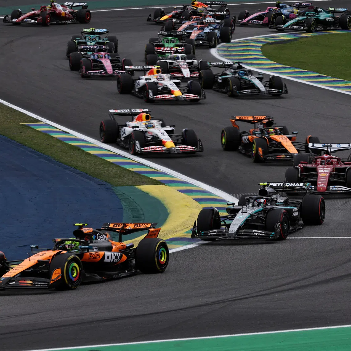 Formula One F1 - Sao Paulo Grand Prix - Autodromo Jose Carlos Pace, Sao Paulo, Brazil - November 9, 2025 McLaren's Lando Norris leads at the start of the race REUTERS/Amanda Perobelli