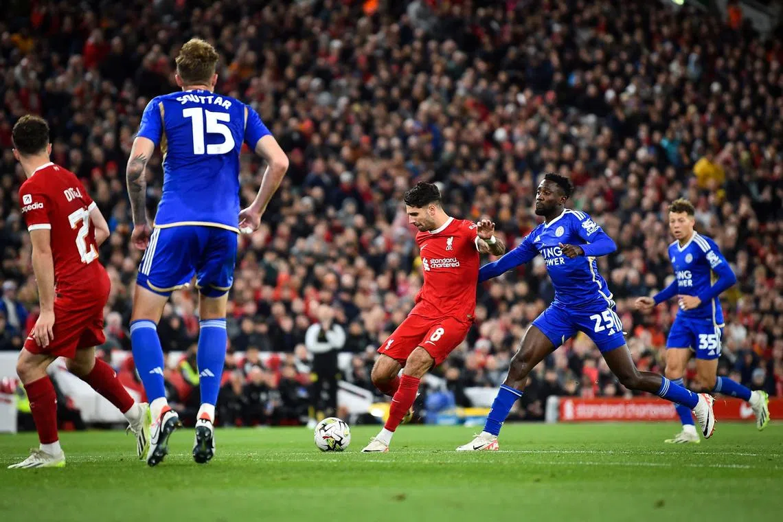 Liverpool's Hungarian midfielder Dominik Szoboszlai shoots and scores his team second goal in the 3-1 League Cup third-round win over Leicester City.