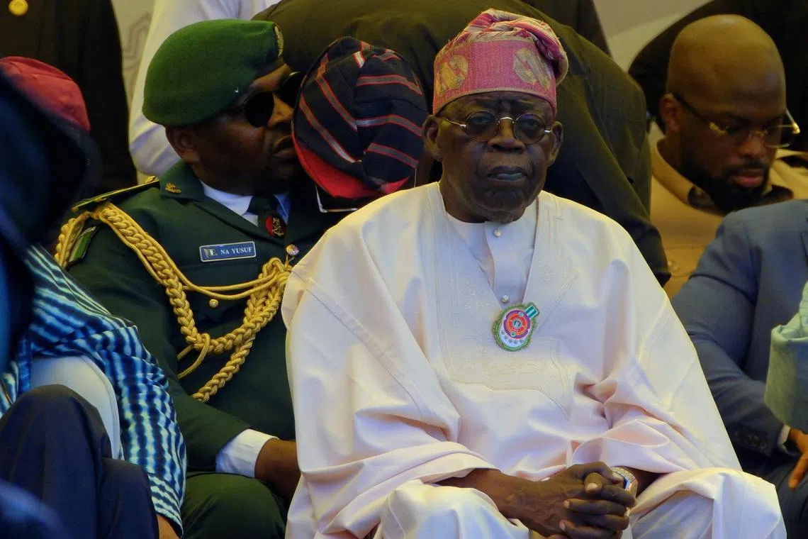 FILE PHOTO: Nigeria's President Bola Ahmed Tinubu attends John Dramani Mahama's swearing-in ceremony for his second term as Ghana's president, in Accra, Ghana January 7, 2025. REUTERS/Francis Kokoroko/File Photo