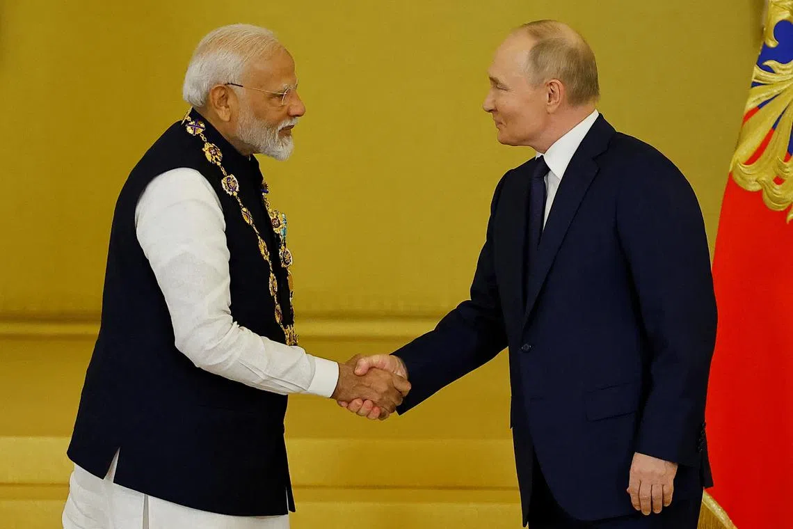 Russia's President Vladimir Putin awards India's Prime Minister Narendra Modi with the Order of St. Andrew the Apostle the First-Called at the Kremlin in Moscow, Russia July 9, 2024. REUTERS/Evgenia Novozhenina