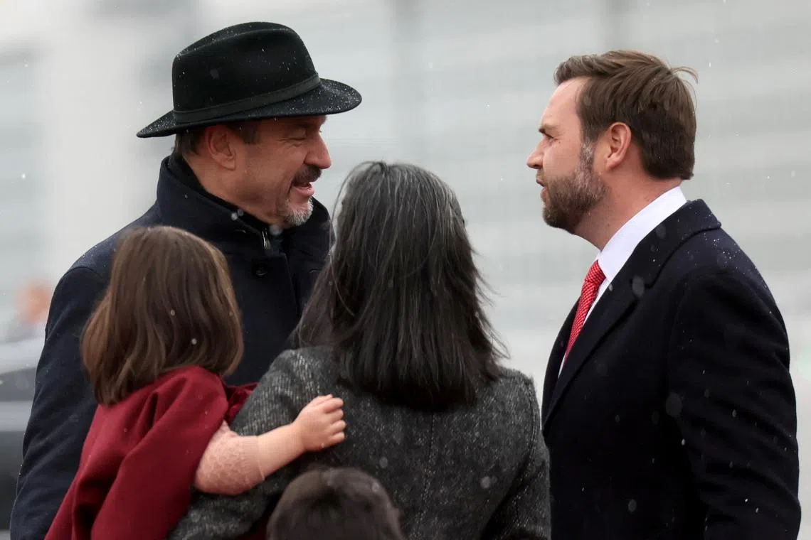 U.S. Vice President JD Vance, second lady Usha Vance and their children Mirabel, Ewan and Vivek are welcomed by Bavarian Premier Markus Soeder as JD Vance arrives to attend the international Munich Security Conference (MSC), at Munich Franz Josef Strauss Airport, in Munich, Germany February 13, 2025. REUTERS/Leah Millis