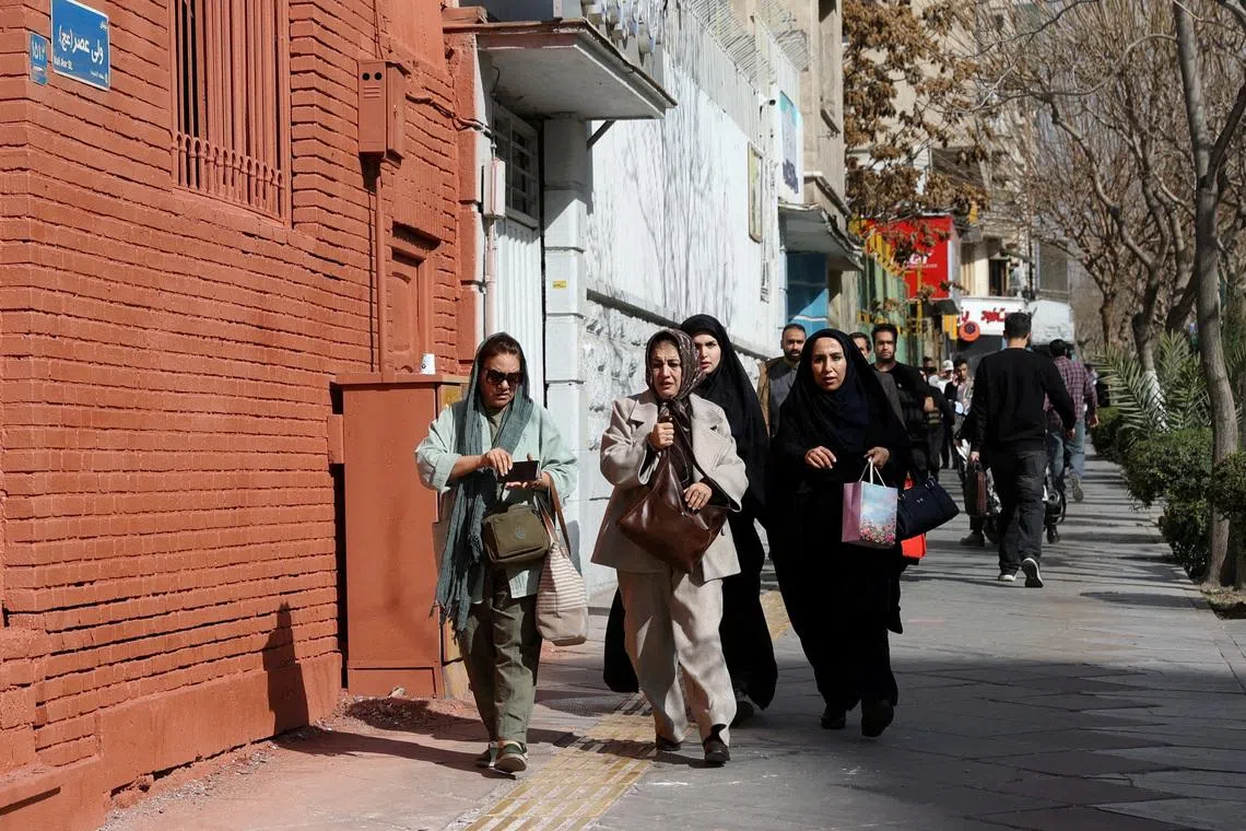 People running for cover following an explosion, after Israel said it launched a pre-emptive attack against Iran, in Tehran, Iran, on Feb 28, 2026. 