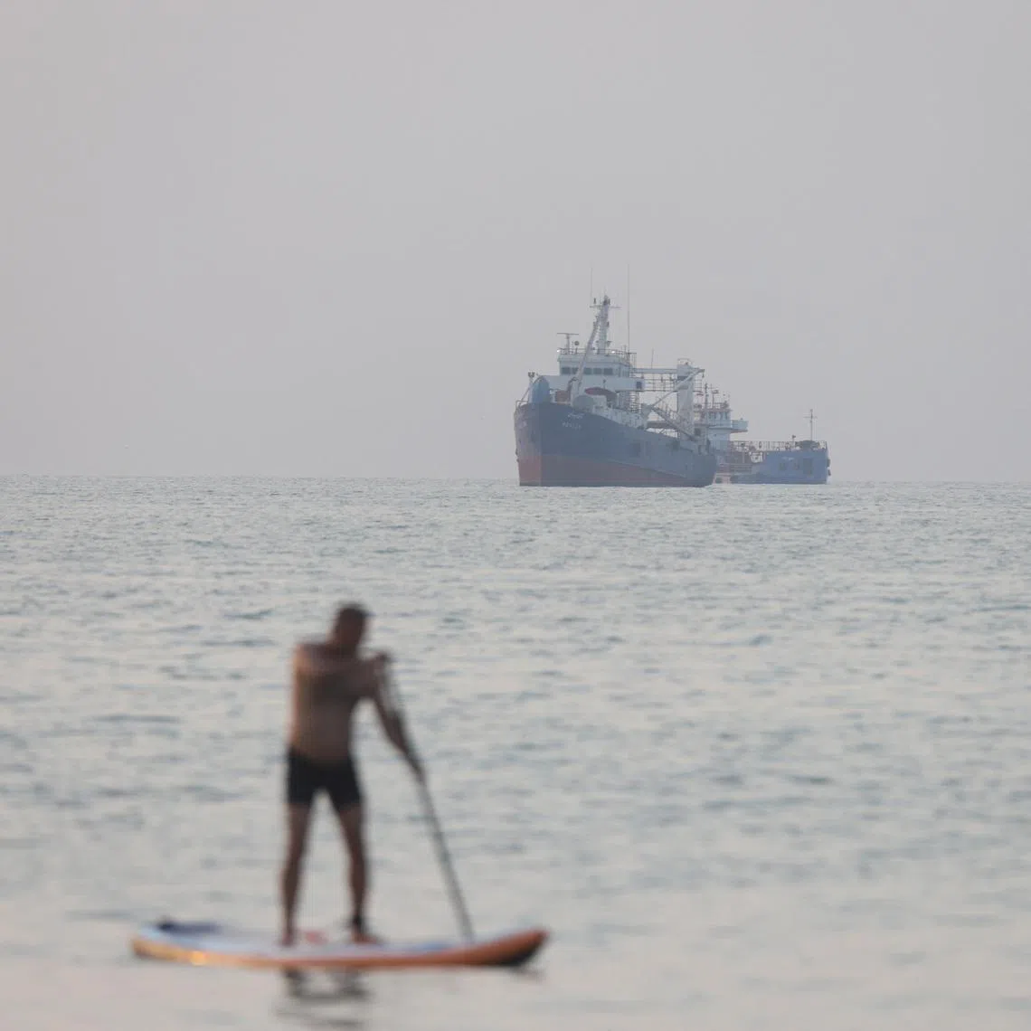 The UN’s maritime agency temporarily paused its operation to escort ships through the Strait of Hormuz after an attack on a tanker near Oman on June 25.