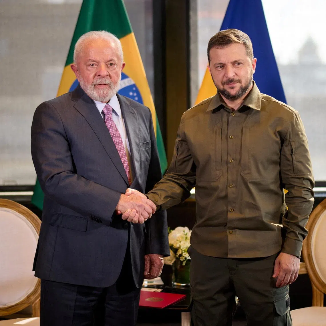 FILE PHOTO: Ukraine's President Volodymyr Zelenskiy and Brazil's President Luiz Inacio Lula da Silva shake hands before their meeting on the sidelines of the 78th Session of the U.N. General Assembly in New York City, U.S., September 20, 2023. Ukrainian Presidential Press Service/Handout via REUTERS/File Photo
