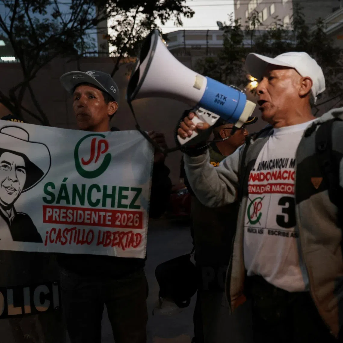 A supporter of Peru's left-wing presidential candidate Roberto Sanchez uses a megaphone as supporters of Sanchez gather outside the National Jury of Elections (JNE) while vote counting continues in the presidential runoff between Sanchez and conservative candidate Keiko Fujimori, in Lima, Peru, June 9, 2026. REUTERS/Stifs Paucca