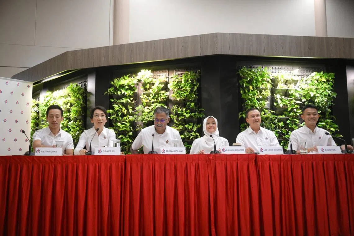 PAP's candidate for Jurong Central SMC, Mr Xie Yao Quan (far left), and PAP's team for Jurong East-Bukit Batok GRC (from second left), Ms Grace Fu, Mr Murali Pillai, Ms Rahayu Mahzam, Mr Lee Hong Chuang and Mr David Hoe at Jurong-Clementi Town Council on April 14.