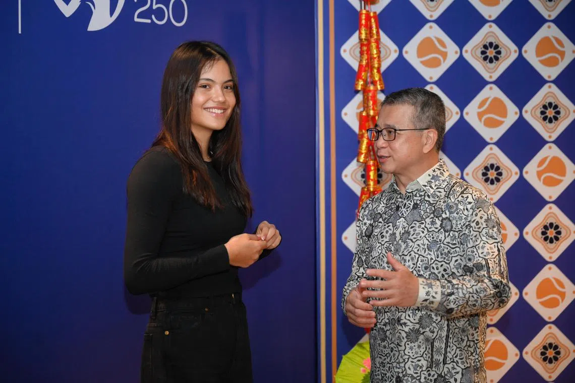 Edwin Tong (right), the Minister for Culture, Community and Youth of Singapore, and British tennis player Emma Raducanu speak during the Singapore Tennis Open 2025 Players Welcome Party.