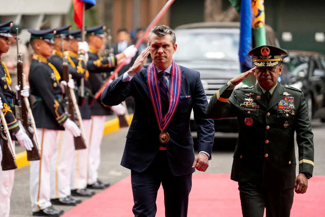 FILE PHOTO: U.S. Defense Secretary Pete Hegseth and Chief of Staff of the Armed Forces of the Philippines Romeo Brawner Jr inspect honor guards during their arrival at Camp Aguinaldo, in Quezon City, Metro Manila, Philippines, March 28, 2025. REUTERS/Lisa Marie David./File Photo