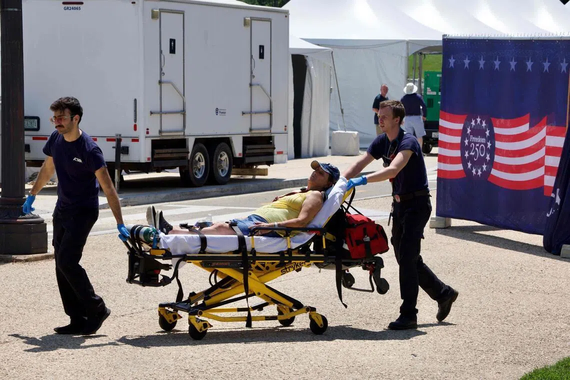 A person is helped by first responders in Washington on July 3, as high temperatures grip the US capital ahead of Independence Day celebrations.